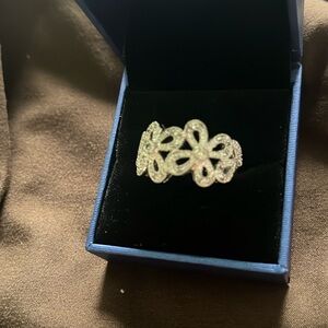 Silver ring with clear stone flowers